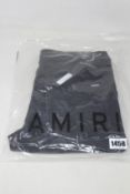 A pair of as new Amiri MX1 leather patch jeans (Size 31).