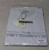 An as new unisex Vetements The Logo T-shirt in white (M).