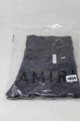 A pair of as new Amiri MX1 leather patch jeans (Size 34).
