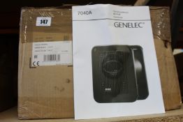 A Genelec 7040A ultra compact active subwoofer.