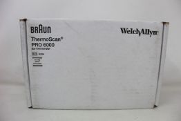 A boxed as new Welch Allyn Braun ThermoScan PRO 6000 ear thermometer with cradle.