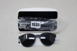 A pair of as new Calvin Klein sunglasses.