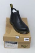 A pair of youths as new Dr Martens 2976 boots (UK 4).