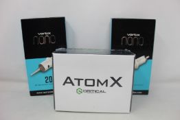 A boxed as new Critical Tattoo Supply AtomX silver power supply and two boxes of Vertix Nano