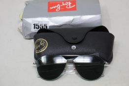 A pair of as new Ray Ban sunglasses.