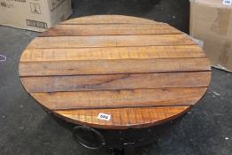 An original Kadai firebowl with a Kadai natural table top and a Kadai swing grill.