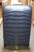 An as new Samsonite Lite-Shock Spinner 69 suitcase in dark blue.