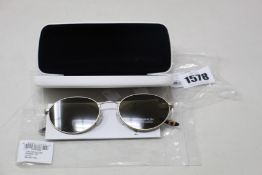A pair of as new Calvin Klein sunglasses.