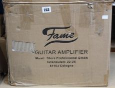 A Fame GX-30G Guitar Amplifier (Requires UK adaptor).
