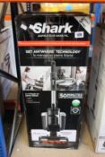 A Shark IC16OEU cordless vacuum cleaner.
