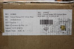 A boxed as new West Elm curved terrace bedside table in antique brass.