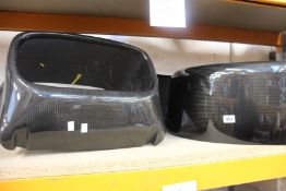 A carbon fibre nose cone and a pair of wheel arches (Possibly for Caterham, items have some minor