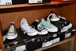 Six pairs of assorted as new Converse canvas sneakers.