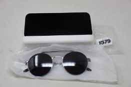 A pair of as new Calvin Klein sunglasses.