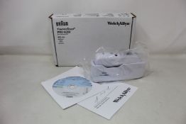 A boxed as new Welch Allyn Braun ThermoScan PRO 6000 ear thermometer with cradle.