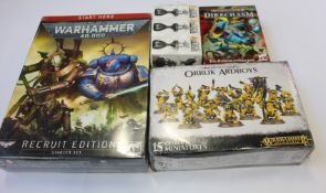 A quantity of Warhammer 40,000 miniatures and related items to include two recruit edition starter