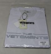An as new unisex Vetements The Logo T-shirt in white (L).