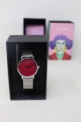 A women's as new Coluri Kahlo watch in scarlet (RRP £139).