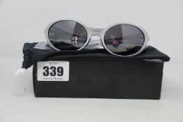 A boxed as new Oakley Eyejacket Redux Silver frame with prizm black polarized lenses (