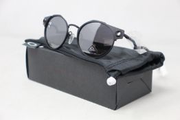 A boxed as new pair of Oakley Deadbolt sunglasses Satin Black frame with Prizm Black Polarized