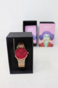 A women's as new Coluri Pankhurst watch in scarlet (RRP £139).