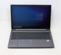 A boxed pre-owned 15