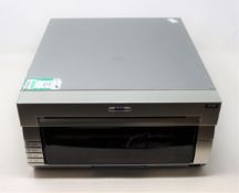 COLLECTION ONLY: A pre-owned DNP DS40 photo printer (Some cosmetic damage).