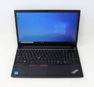 A boxed pre-owned 15.6