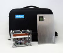 A pre-owned miniPCR thermal cycler for labs and classrooms with 20000mAh miniPCR power pack and