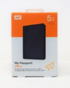 A boxed as new WD My Passport Ultra 5TB in Blue (M/N: WDBFTM0050BBL-WESN.) (Box sealed).