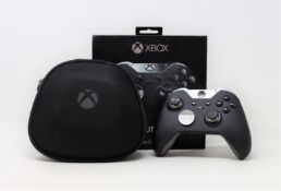 A pre-owned boxed Xbox Elite wireless controller for Xbox One and Windows in black/silver (series 1)