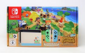 A boxed as new Nintendo Switch console in animal crossing: new horizons design (box opened).