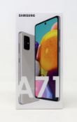 A boxed as new Samsung A71 SM-A715F 128GB in Haze Crush Silver (Box sealed, some cosmetic damage