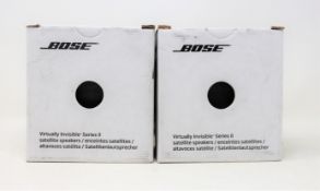A pair of boxed as new Bose Virtually Invisible Series II speakers in white.