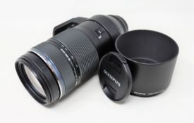 A boxed as new Olympus M.Zuiko Digital ED 100-400mm F5.0-6.3 IS Zoom Lens in Black (Box opened,