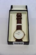 A pre-owned Daniel Wellington watch with box (Very good condition).