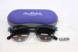 A pair of as new Anne & Valentin sunglasses.