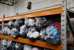 Twelve bags of pre-owned clothing and related items.