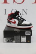 A pair of youths as new Nike Air Jordan 1 (UK 3).