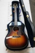 A Gibson L-00 1937 Reissue Acoustic guitar with hard case.