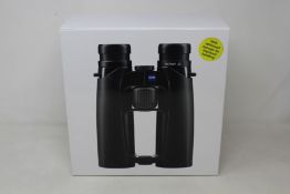 A boxed as new pair of Zeiss Victory SF 8x32 binoculars.