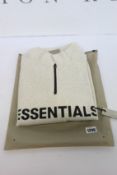 An as new Essentials Fear of God mockneck half zip in oatmeal (M).