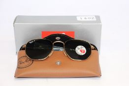 A pair of as new Ray Ban sunglasses.