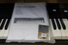 A pre-owned Roland RD-2000 Stage Piano (Item had damage to outer casing, some keys get stuck,