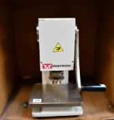 A pre-owned Instron hollow die punch (C-6051-000).