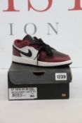A pair of youths as new Nike Air Jordan 1 Low SE (UK 5).