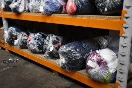 Six bags of pre-owned clothing and related items.