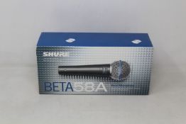 A boxed as new Shure Beta 58A Supercardioid Dynamic vocal microphone.
