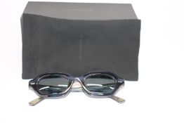 A pair of as new Oliver Peoples The Row sunglasses.