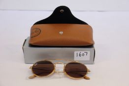 A pair of as new Ray Ban sunglasses.